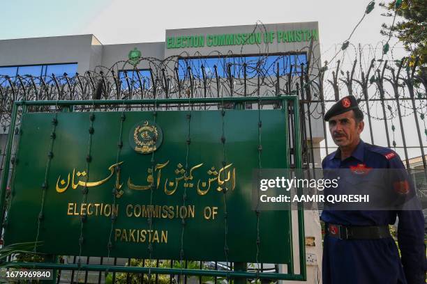 Security personnel stands guard at the headquarters of Election Commission of Pakistan in Islamabad on September 21, 2023. Pakistan will hold delayed...