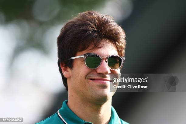 Lance Stroll of Canada and Aston Martin F1 Team walks in the Paddock during previews ahead of the F1 Grand Prix of Singapore at Marina Bay Street...