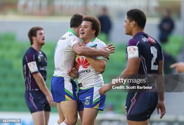 Jordan Worboys of the Raiders is congratulated by his teammates after scoring a try during the round eight Holden Cup match between the Melbourne...