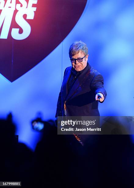 Elton John performs at the 20th Annual Race To Erase MS Gala "Love To Erase MS" at the Hyatt Regency Century Plaza on May 3, 2013 in Century City,...