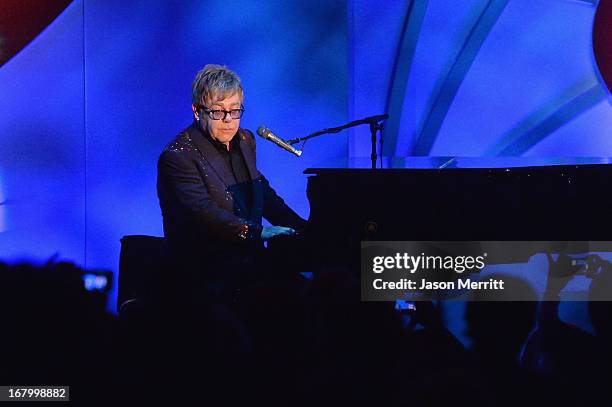 Elton John performs at the 20th Annual Race To Erase MS Gala "Love To Erase MS" at the Hyatt Regency Century Plaza on May 3, 2013 in Century City,...