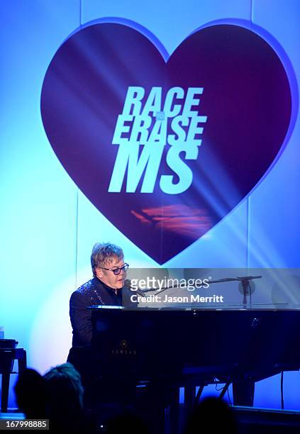 Elton John performs at the 20th Annual Race To Erase MS Gala "Love To Erase MS" at the Hyatt Regency Century Plaza on May 3, 2013 in Century City,...