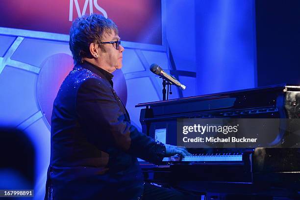 Elton John performs at the 20th Annual Race To Erase MS Gala "Love To Erase MS" at the Hyatt Regency Century Plaza on May 3, 2013 in Century City,...