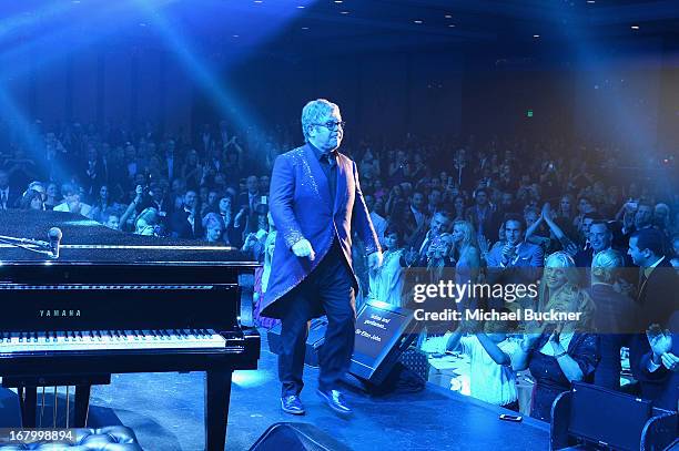 Elton John performs at the 20th Annual Race To Erase MS Gala "Love To Erase MS" at the Hyatt Regency Century Plaza on May 3, 2013 in Century City,...