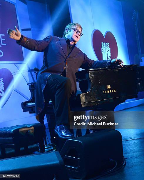 Elton John performs at the 20th Annual Race To Erase MS Gala "Love To Erase MS" at the Hyatt Regency Century Plaza on May 3, 2013 in Century City,...