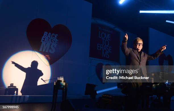 Elton John performs at the 20th Annual Race To Erase MS Gala "Love To Erase MS" at the Hyatt Regency Century Plaza on May 3, 2013 in Century City,...