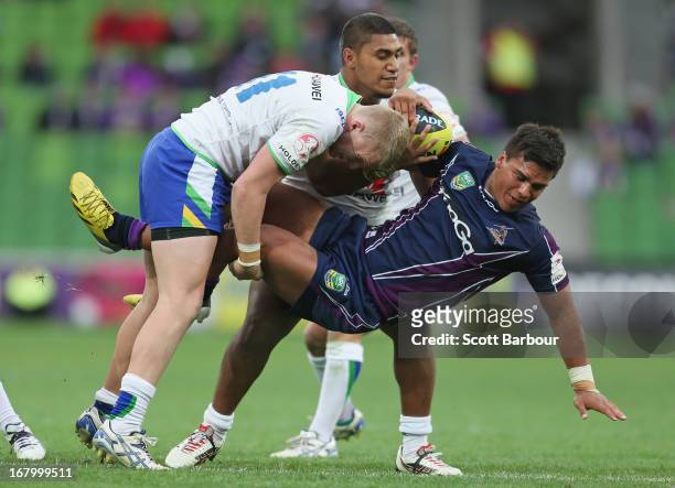 Pride Petterson-Robati of the Storm is tackled during the round eight Holden Cup match between the Melbourne Storm and the Canberra Raiders at AAMI...