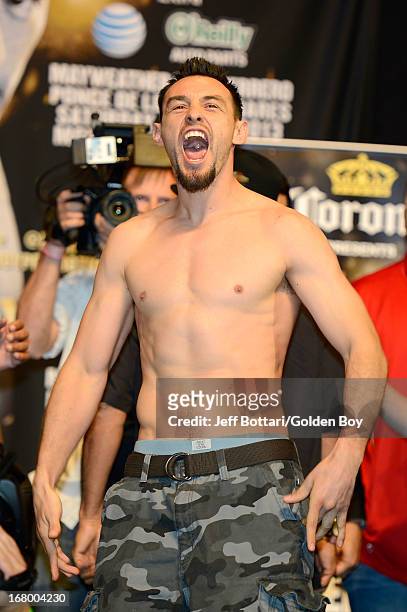 Boxer Robert Guerrero reacts to the crowd on stage during the official weigh-in for his welterweight bout against Floyd Mayweather Jr. At the MGM...