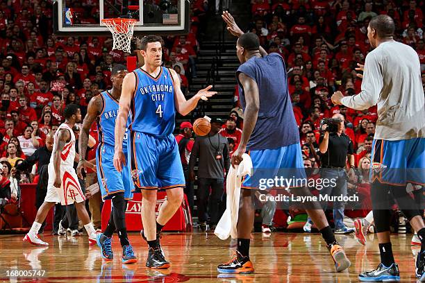 Nick Collison of the Oklahoma City Thunder celebrates with teammates while playing the Houston Rockets in Game Six of the Western Conference...