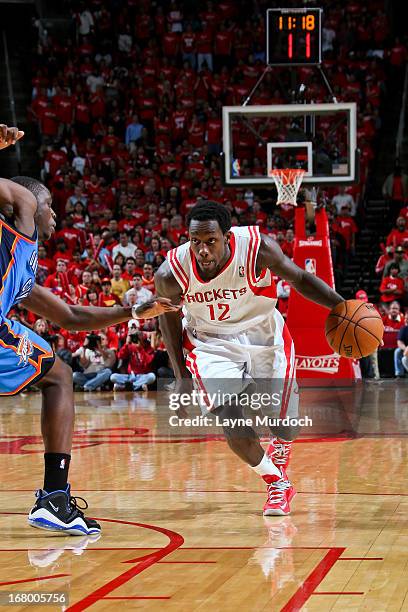 Patrick Beverley of the Houston Rockets drives against Reggie Jackson of the Oklahoma City Thunder in Game Six of the Western Conference...