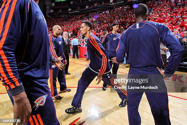 Thabo Sefolosha of the Oklahoma City Thunder greets teammates before playing against the Houston Rockets in Game Six of the Western Conference...