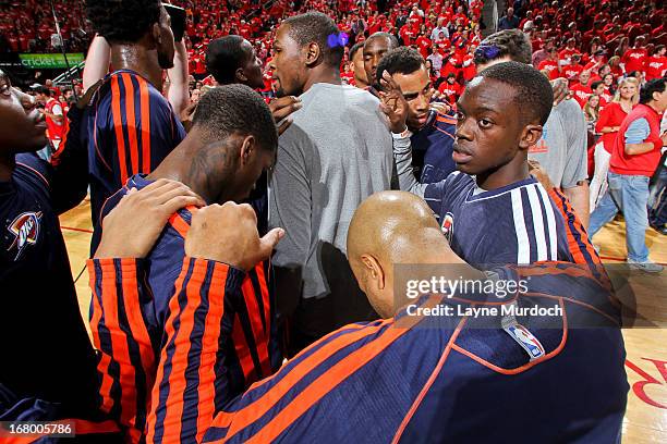 The Oklahoma City Thunder huddle up before playing against the Houston Rockets in Game Six of the Western Conference Quarterfinals during the 2013...