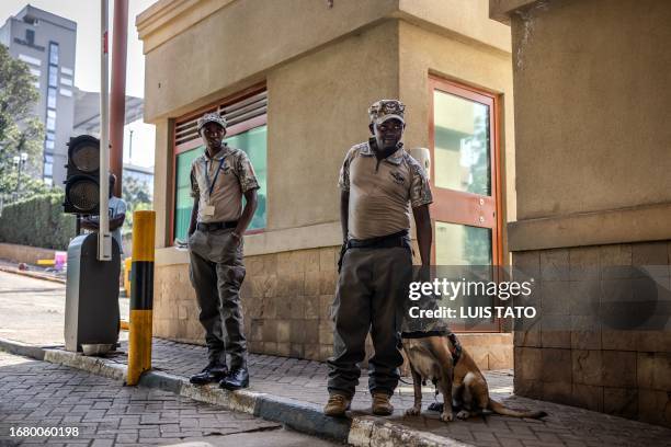 Private security officers using a detection monitor the access to the Westgate Mall in Nairobi on September 21, 2023.On September 21 Al-Shabaab...