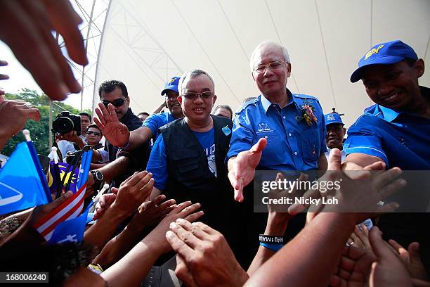 Malaysia's Prime Minister and Barisan Nasional chairman Najib Razak greets supporters during an election rally to address young parliamentary...