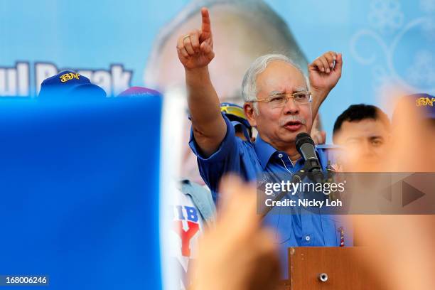 Malaysia's Prime Minister and Barisan Nasional chairman Najib Razak greets supporters during an election rally to address young parliamentary...