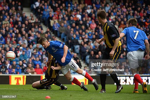 Fraser Aird of Rangers scores during the IRN-BRU Scottish Third Division match at Ibrox Stadium on May 4, 2013 in Glasgow, Scotland.