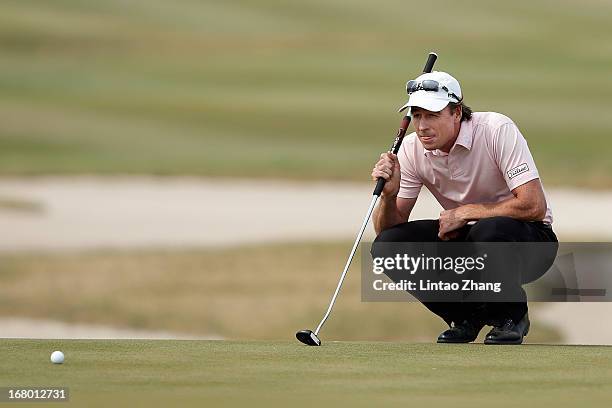 Brett Rumford of Australia lines up a putt during the third day of the Volvo China Open at Binhai Lake Golf Course on May 4, 2013 in Tianjin, China.