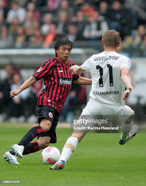 Inui Takashi of Frankfurt challenges Maximilian Beister of Duesseldorf during the Bundesliga match between Eintracht Frankfurt and Fortuna...