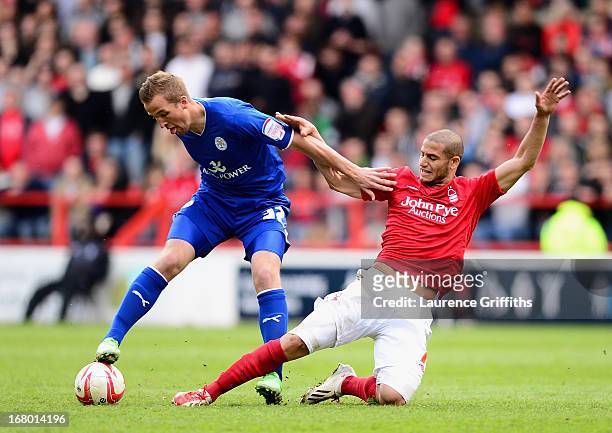 Harry Kane of Leicester City battles with Adlene Guedioura of Nottingham Forest during the npower Championship match between Nottingham Forest and...