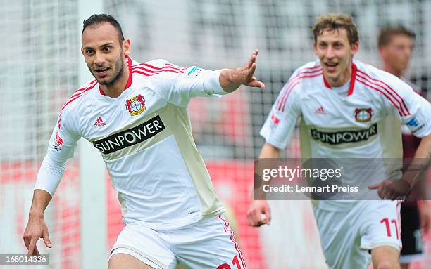 Oemer Toprak and Stefan Kiessling of Leverkusen celebrate a goal during the Bundesliga match between 1. FC Nuernberg and Bayer 04 Leverkusen at...