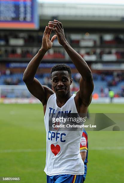 Wilfred Zaha of Palace shows off a t-shirt saying "Thank You CPFC" during the players parade after the match during the npower Championship match...