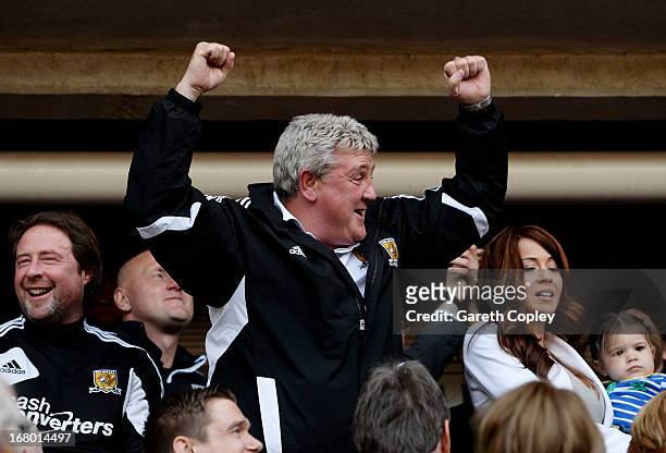 Steve Bruce the Hull manager celebrates following his team's promotion to the Premier League during the npower Championship match between Hull City...