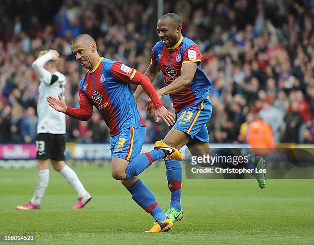 Kevin Phillips of Palace is chased by Danny Gabbidon after he scores their second goal during the npower Championship match between Crystal Palace...