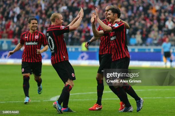 Srdjan Lakic of Frankfurt celebrates his team's second goal with team mates Bamba Anderson, Sebastian Rode and Stefano Celozzi during the Bundesliga...