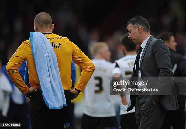 Manager Darren Ferguson of Peterborough looks dejected as he leaves the field with goalkeeper Bobby Olejnik during the npower Championship match...