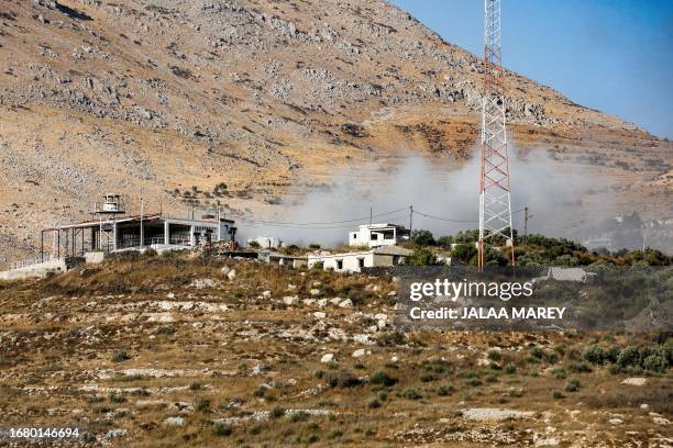 This picture taken from the Druze village of Majdal Shams in the Israel-annexed Golan Heights shows smoke billowing from a Syrian position along the...