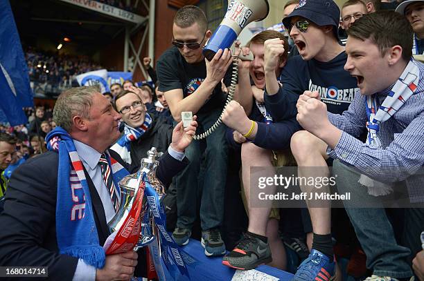 Manager Ally McCoist of Rangers holds the IRN - BRU Scottish Third Division trophy as he meets fans following his team's victory over Berwick Rangers...