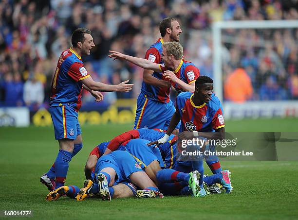 Palace players celebrate their second goal scored by Kevin Phillips as they all jump on top of him during the npower Championship match between...