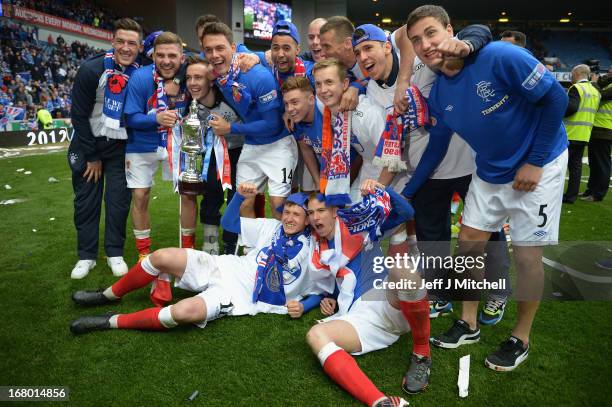 Rangers players celebrate with the IRN - BRU Scottish Third Division trophy following their victory over Berwick Rangers at Ibrox Stadium on May 4,...