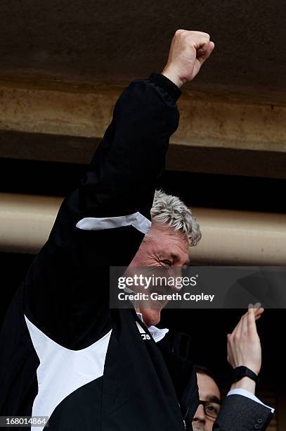 Steve Bruce the Hull manager celebrates following his team's promotion to the Premier League during the npower Championship match between Hull City...