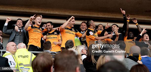 Hull players celebrate following their team's promotion to the Premier League during the npower Championship match between Hull City and Cardiff City...