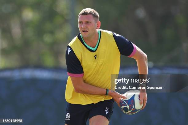 Finn Russell of Scotland passes during a Scotland training session at the Rugby World Cup France 2023 at Stade des Arboras on September 14, 2023 in...