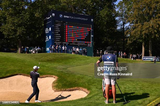 Joakim Lagergren of Sweden plays a shot from a greenside bunker on the 18th hole during Day One of the BMW PGA Championship at Wentworth Golf Club on...
