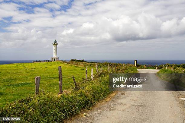 to the lighthouse... - lastres stock pictures, royalty-free photos & images