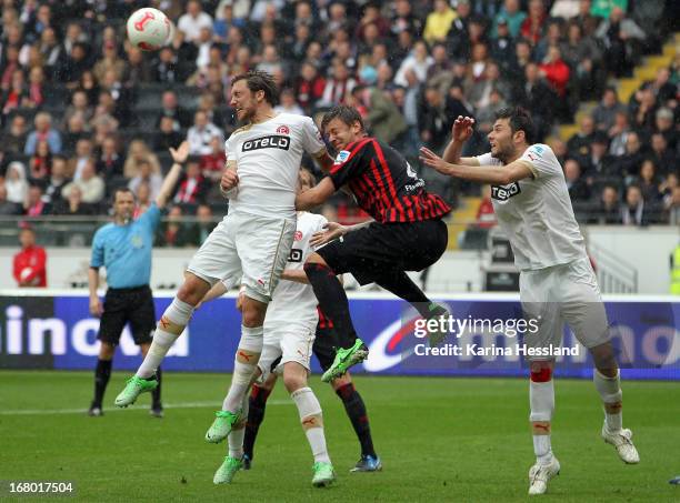 Marco Russ of Frankfurt challenges Oliver Fink and Adam Bodzek of Duesseldorf during the Bundesliga match between Eintracht Frankfurt and Fortuna...