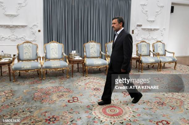 Iranian President Mahmoud Ahmadinejad arrives ahead of his meeting with Indian Foreign Minister Salman Khurshid in Tehran on May 4, 2013. AFP...