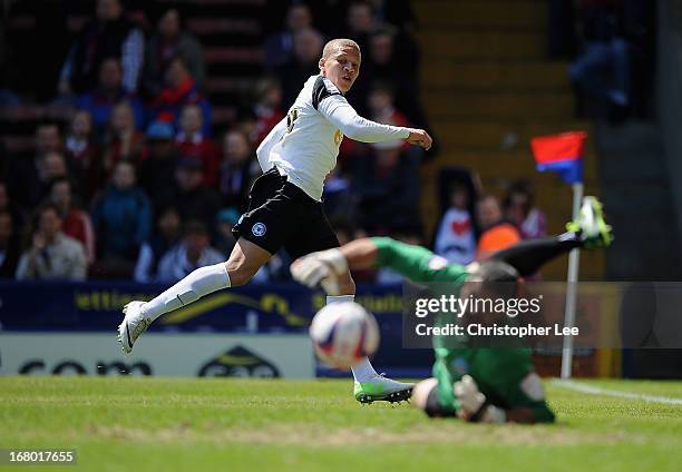 Dwight Gayle of Peterborough has his shot saved by Julian Speroni of Palace during the npower Championship match between Crystal Palace and...