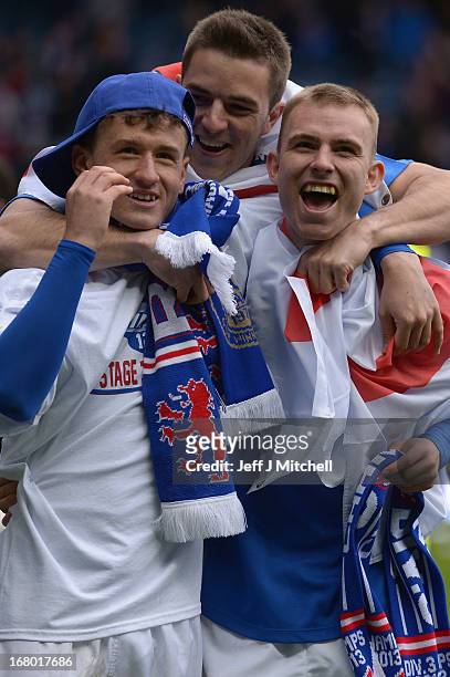 Rangers players Fraser Aird, Andy Little and Andy Mitchell celebrate after wining the IRN - BRU Scottish Third Division trophy following the match...