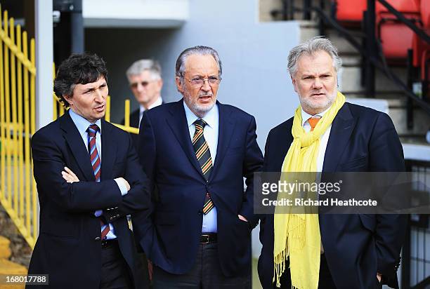 Watford owner Giampaolo Pozzo and son Gino talk to technical director Gianluca Nani after the npower Championship match between Watford and Leeds...
