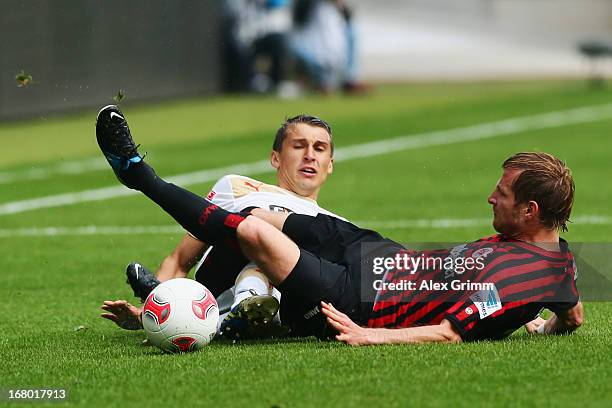 Stefan Aigner of Frankfurt is challenged by Robert Tesche of Duesseldorf during the Bundesliga match between Eintracht Frankfurt and Fortuna...