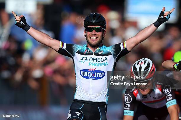 Mark Cavendish of Great Britain and Omega Pharma - Quick-Step celebrates as he crosses the finish line to win stage one of the 2013 Giro d'Italia on...