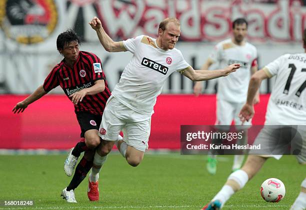 Inui Takashi of Frankfurt challenges Tobias Levels of Duesseldorf during the Bundesliga match between Eintracht Frankfurt and Fortuna Duesseldorf...