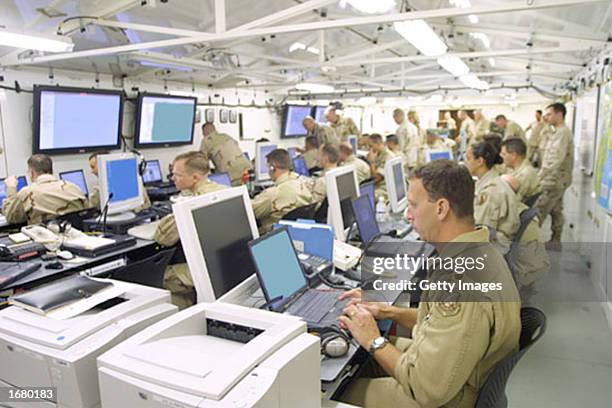 In this U.S. Army handout, soldiers are seen monitoring computer screens inside the U.S. Central Command's "Deployable Headquarters," this image was...