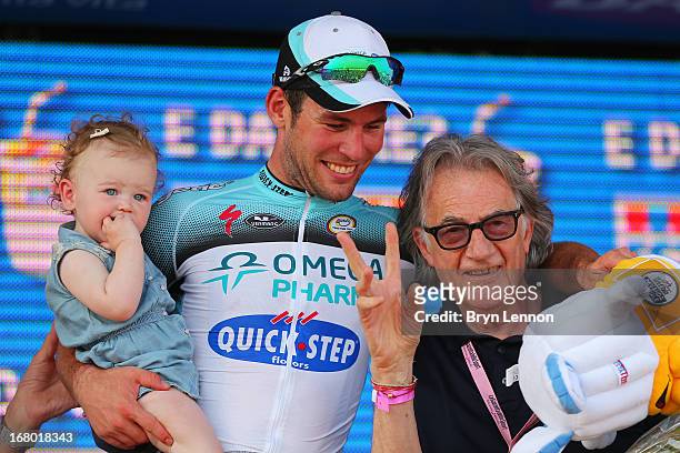 Mark Cavendish of Great Britain and Omega Pharma - Quick-Step celebrates his stage victory with his daughter Delilah Grace and fashion designer Paul...