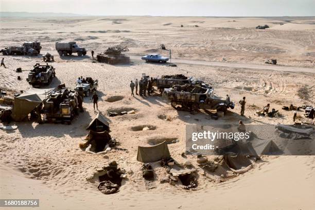 Israeli soldiers controlling the Egyptian 3rd Army, encircled on the east bank of the Suez Canal, gather in an Israeli forward camp in the Sinaï...