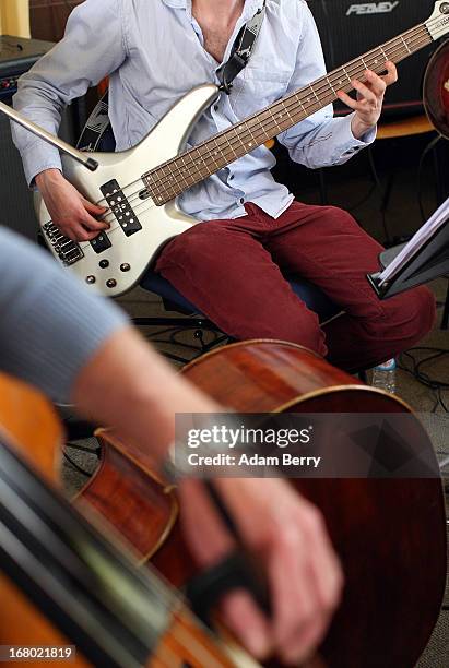 Electric and acoustic bass players in the ORSO Rock Symphony Orchestra rehearse for the ORSO Rock-Symphony-Night, in the Evangelische...